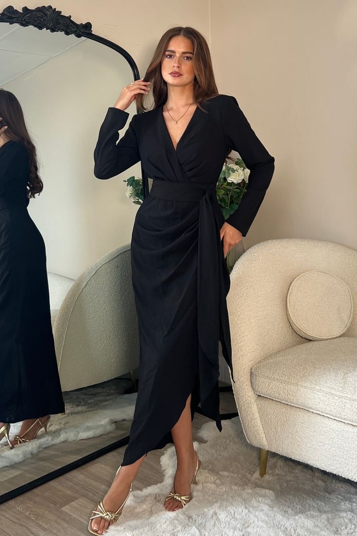 a women wearing black wrap dress
